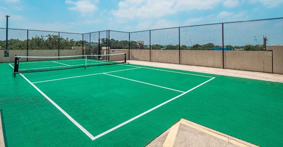 a tennis court on the roof of a building