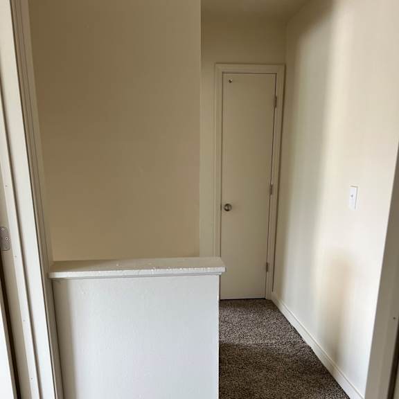 a white refrigerator sitting on top of a wall