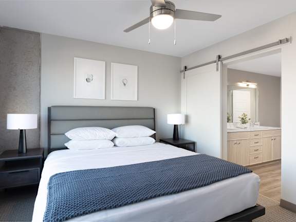 a bedroom with a bed and a ceiling fan  at AVE Phoenix Sky, Phoenix, Arizona