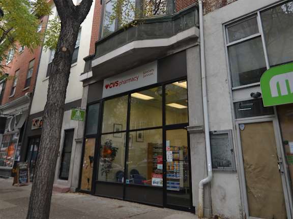A CVS Pharmacy storefront with a green logo on the top right.