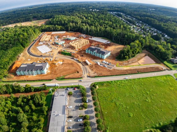 an aerial view of a construction site with roads and buildings