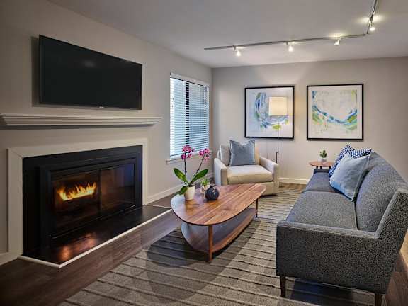 a living room with a couch and a coffee table at Blue Bell Villas