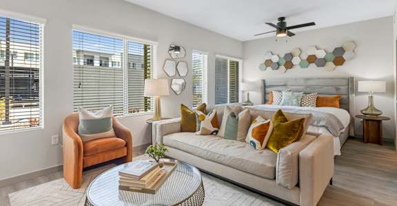 A living room with a sofa, armchair, and a coffee table.