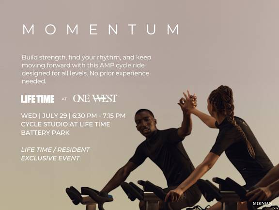 Two people exercising on stationary bikes at a Life Time fitness event.