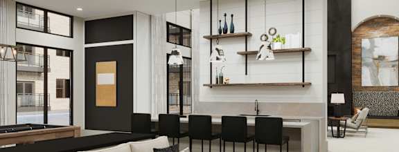 a living room with a couch and a bar and a kitchen