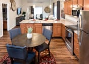 Thumbnail 4 of 9 - Lake Orion Michigan Apartment Rentals Redwood Lake Orion Kitchen with Granite and Stainless