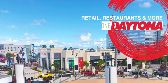 a rendering of the one daytona parking lot with cars and a fountain at Icon One, Daytona Beach, FL, 32114