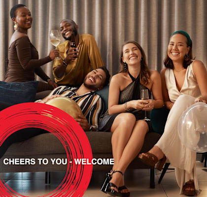 a group of women sitting on a couch drinking wine and laughing at Icon One, Daytona Beach, FL, 32114