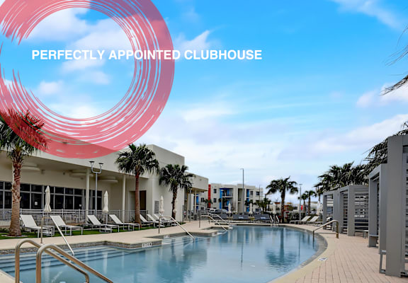 a swimming pool at a club house with palm trees at Icon One, Daytona Beach, FL, 32114
