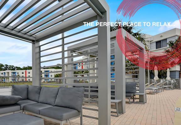 a rendering of a patio area with couches and chairs at Icon One, Daytona Beach, FL, 32114