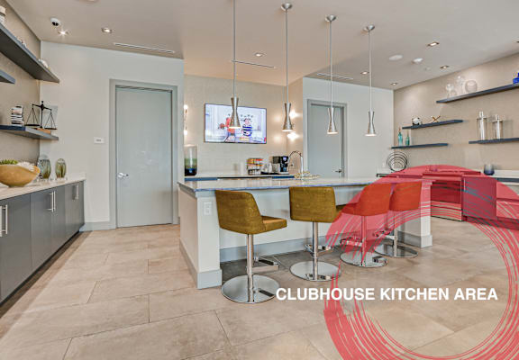 the kitchen and dining area of a club house kitchen area at Icon One, Daytona Beach