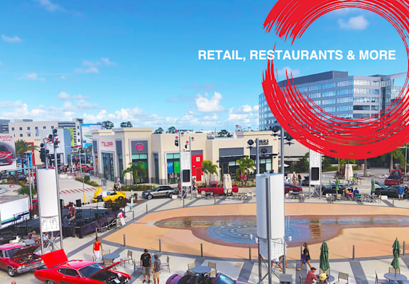 a rendering of retail restaurants and more at the mgm grand with cars parked outside at Icon One, Daytona Beach, 32114