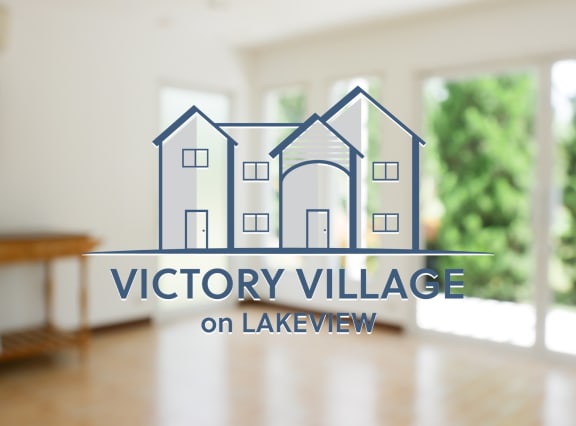 a logo for victory village on lakeview with an image of a house