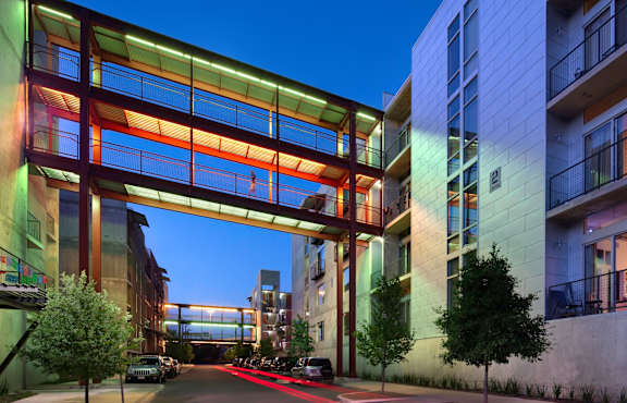 A modern building with a glass and wood structure.
