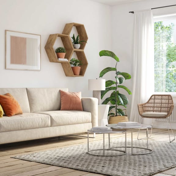 a living room with a couch and a table and plants