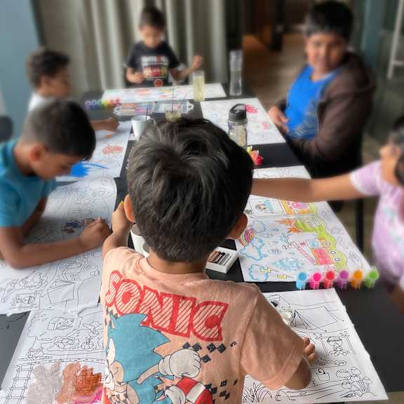 A group of children are sitting at a table coloring at Cherrywood Apartments, D18 VY3V, DUBLIN 18