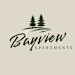 The image is a logo for Bayview Apartments, featuring the name in a stylized font with two trees above it.