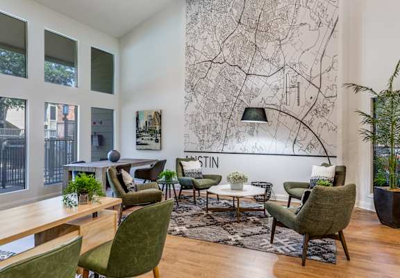 a living room filled with furniture and a large painting on the wall