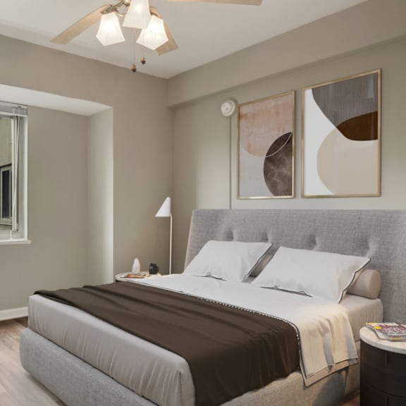 a bedroom with a bed and a ceiling fan