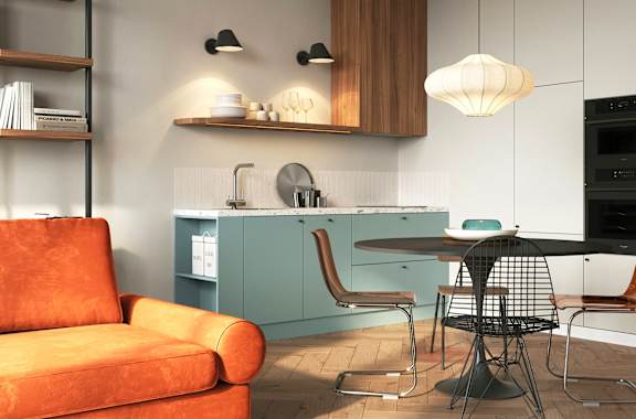 A modern kitchen with a dining table and chairs.