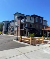 new apartment buildings on the side of a street