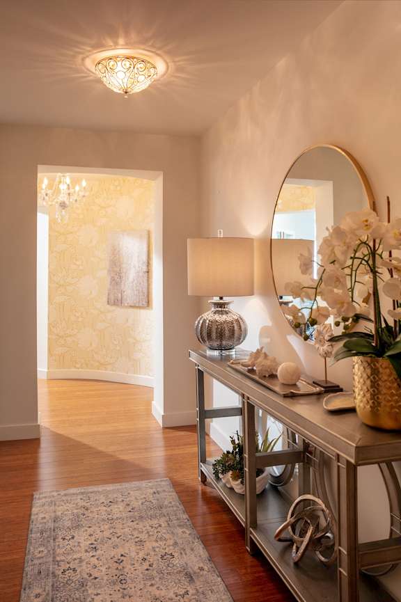 A bedroom with a large bed and a dresser with a plant on top at Residences Providence, Rhode Island 2903