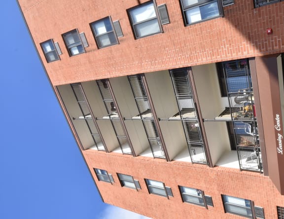 a view of the side of a brick building with windows