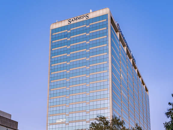 A Sammons building with a clear blue sky in the background.
