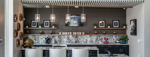 a dining area with a wooden table and chairs
