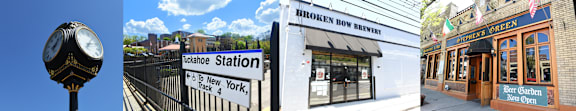 A clock on a pole and a sign for Tuckahoe Station.