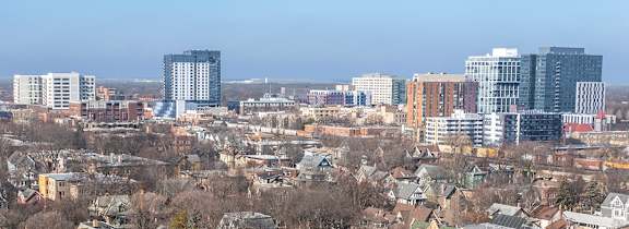 A cityscape with buildings and cars.