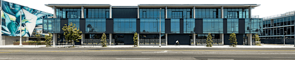A modern building with a large mural on the side.