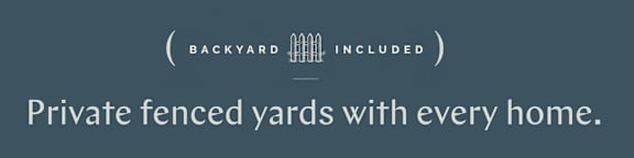 A sign advertising private fenced yards included with every home.