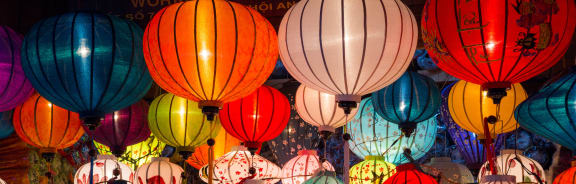 a close up of a bunch of colorful paper lanterns