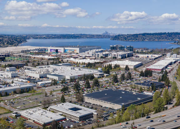 A view of a city with a large body of water in the distance.