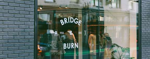 a window display of a store with mannequins in it