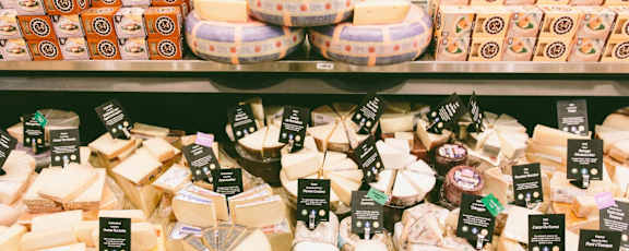 a display of cheese in a supermarket
