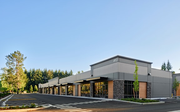 a large building with a street in front of it