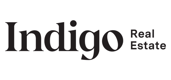 the logo for indigo real estate