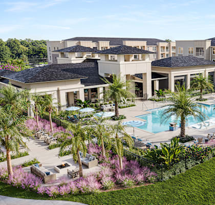 an aerial view of the pool at the resort at longboat key club