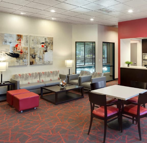 a living room filled with furniture and a large window  at Mears Park Place, St. Paul, Minnesota