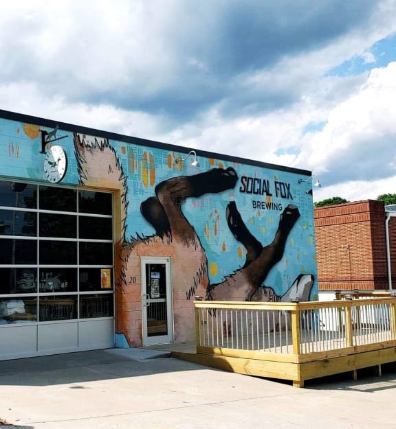 a mural of a fox on the side of a building
