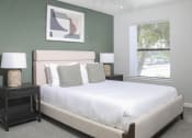 Thumbnail 1 of 5 - a bedroom with a large bed and a window