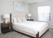 Thumbnail 5 of 5 - a bedroom with a large white bed and a window