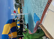Thumbnail 13 of 14 - a view of a pool from a water slide at a water park