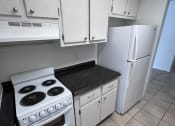 Thumbnail 5 of 12 - an overhead view of a kitchen with a stove and a refrigerator