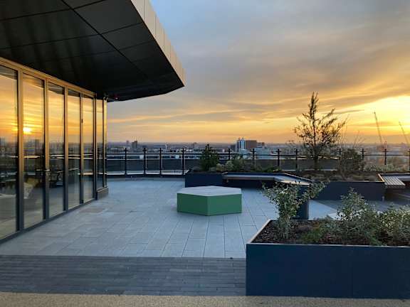 a view of the sunset from the roof of a building at Vox Apartments, Manchester