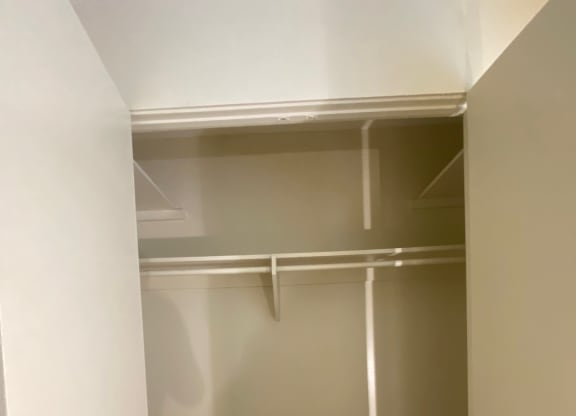 a white kitchen with a white counter top and a refrigerator at Bowles Apts, California