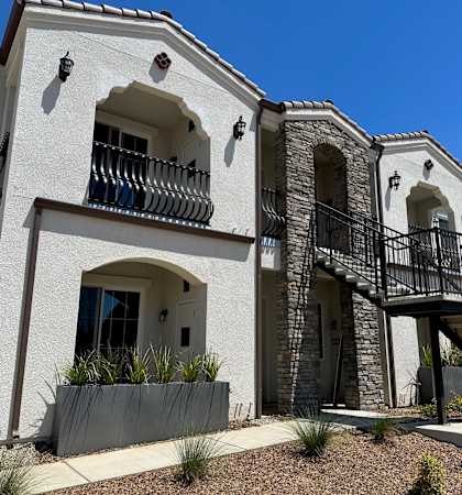 a house with a staircase in front of it