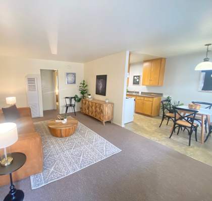 Living room with a couch and a table at Bowles Apts, Azusa
